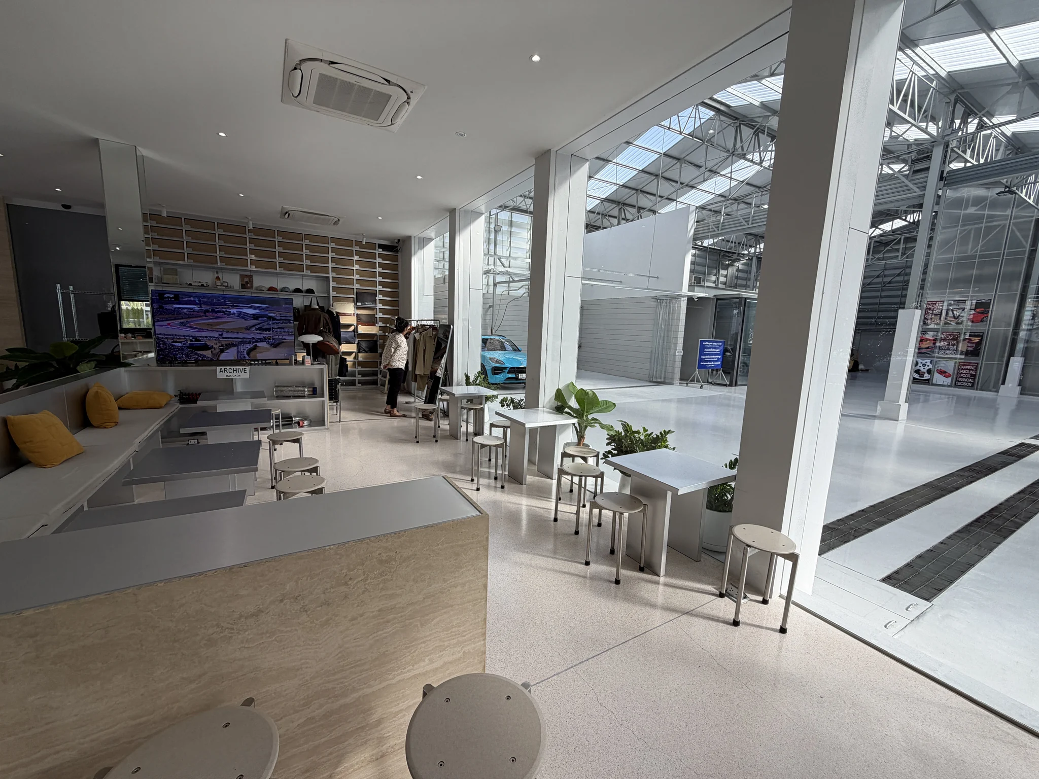 Wide view of the cafe and garage at Archive Coffee