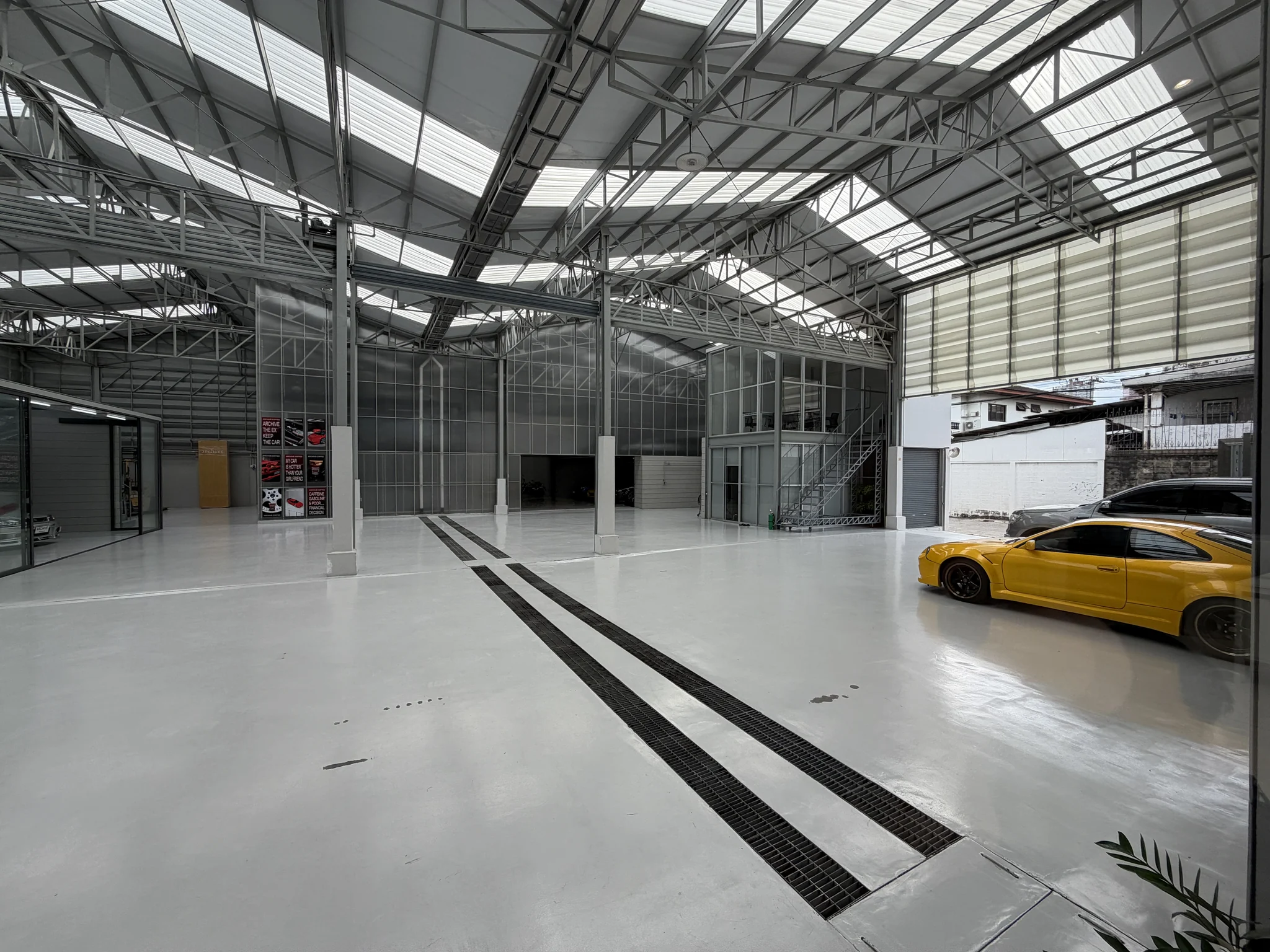 Archive Coffee garage interior with a yellow sports car