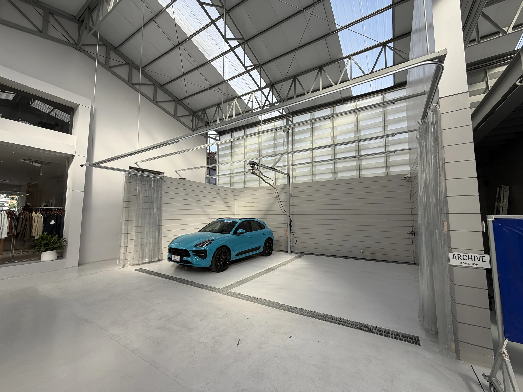 Blue sports car in an Archive Coffee garage bay
