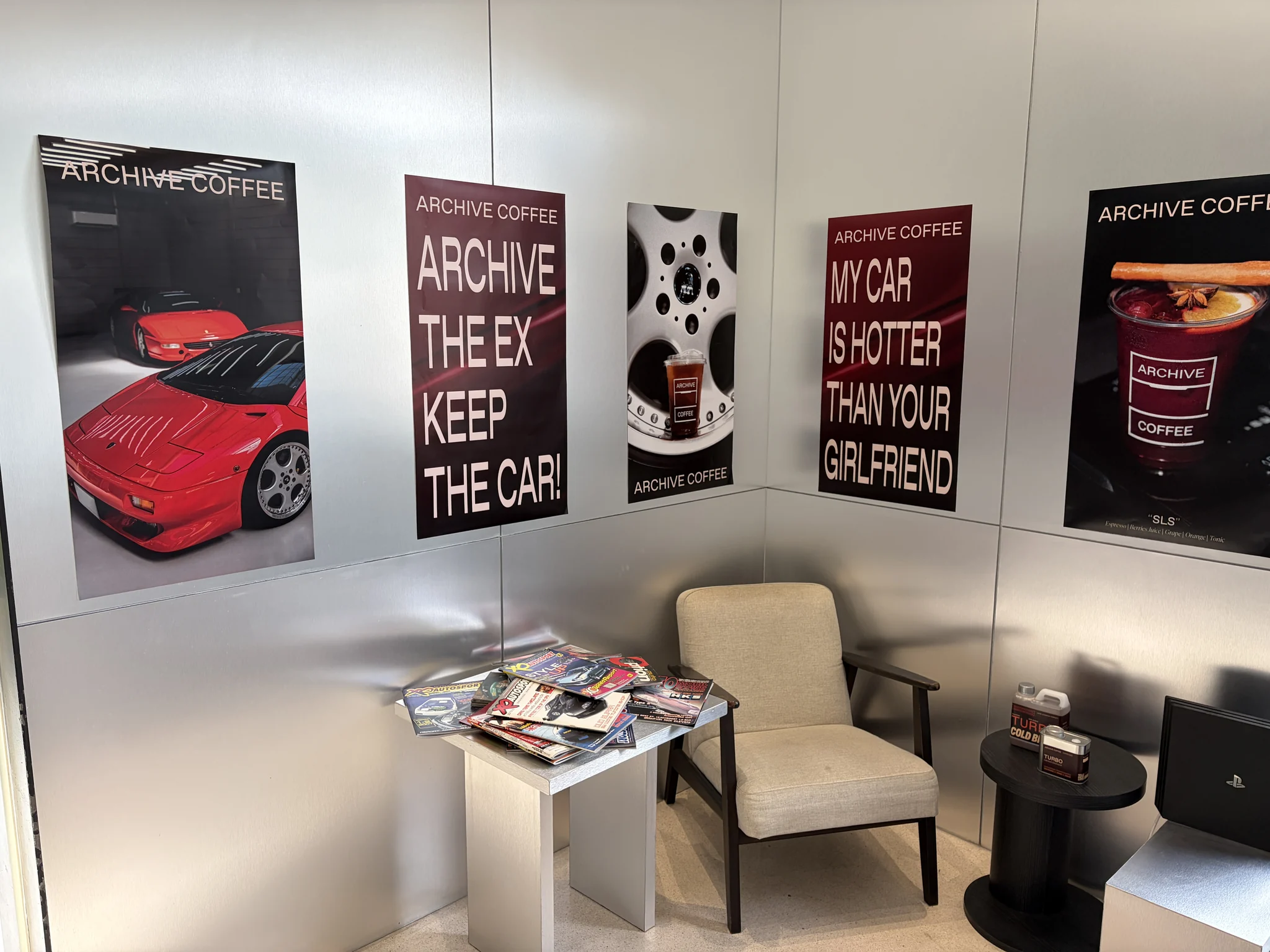 Car-themed wall art inside Archive Coffee